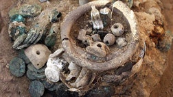   Residents of a town under siege by the Roman army about , years ago buried two hoards of treasure in the towns citadel mdash treasure recently excavated by archaeologists.